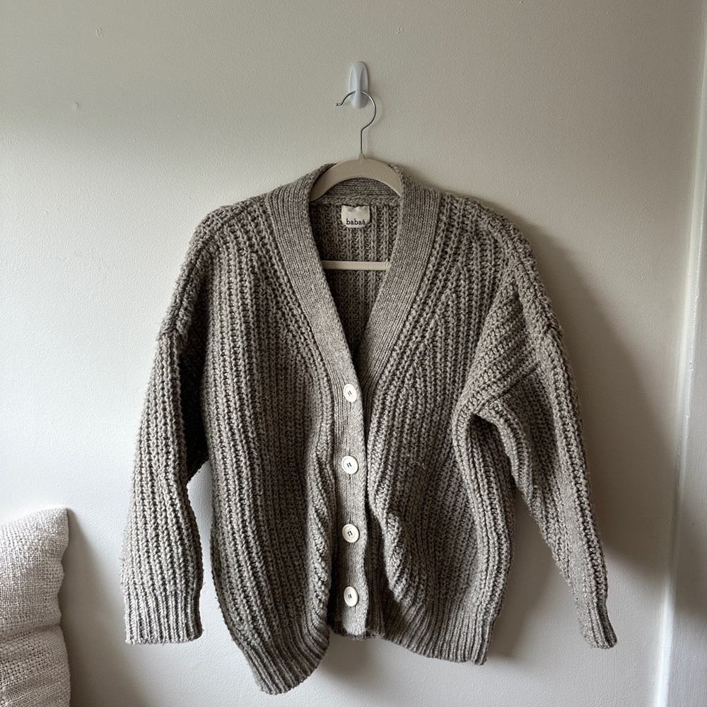 Gray chunky knit cardigan sweater with V-neck design and long sleeves